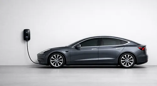 EV charger mounted on a wall of a Rockingham property with a car connected for charging