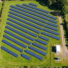 Solar panels arranged on a flat commercial rooftop in Joondanna