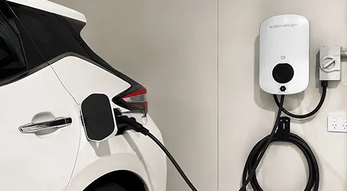 Wall-mounted EV charger beside a driveway at a Mirrabooka residence