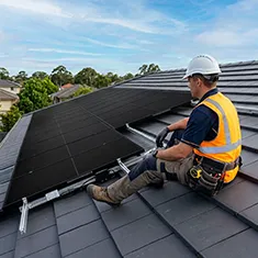 Technician carrying out solar system maintenance in Piara Waters